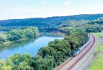 The westbound Pennsylvanian glides along the south bank of the Juniata River